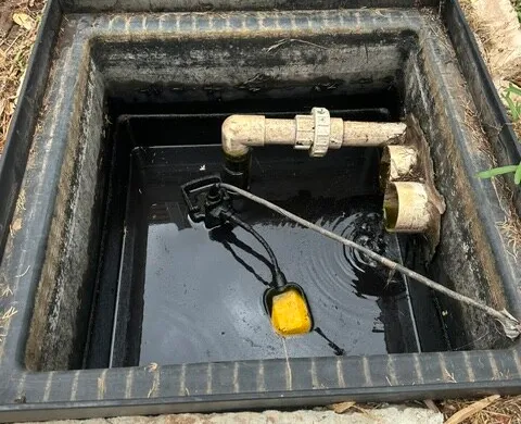 Drainage sump pit with a submersible pump and float switch installed