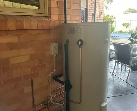 Storage hot water system installed in a side passage