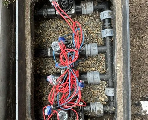 Irrigation valve manifold wired and installed in an in-ground box
