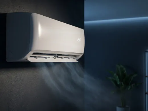 Modern white split-system air conditioner mounted on a dark feature wall