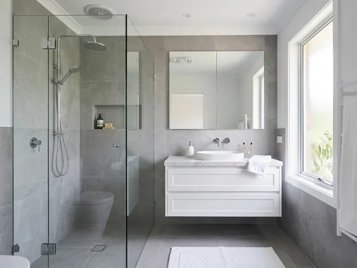 Freshly renovated modern Australian bathroom with chrome tapware, floating vanity and frameless shower